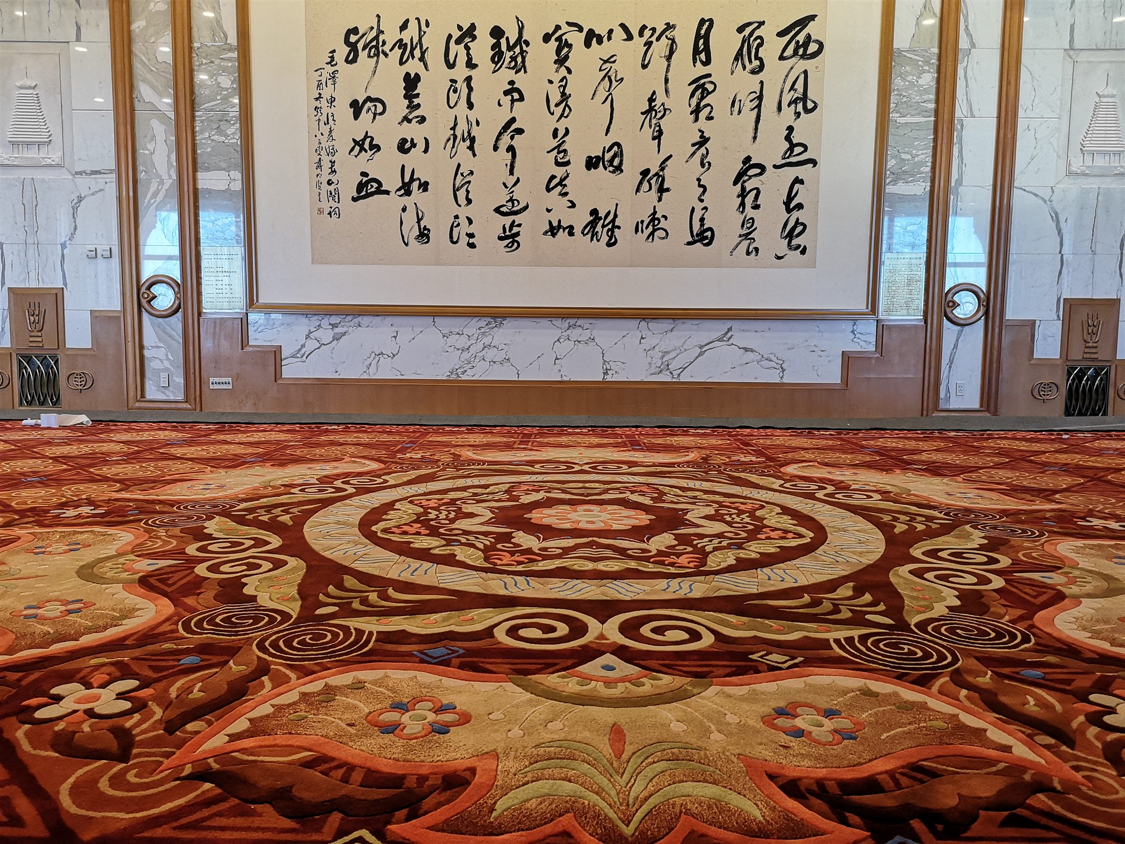 Large ceremonial carpet with a richly detailed red and gold composition