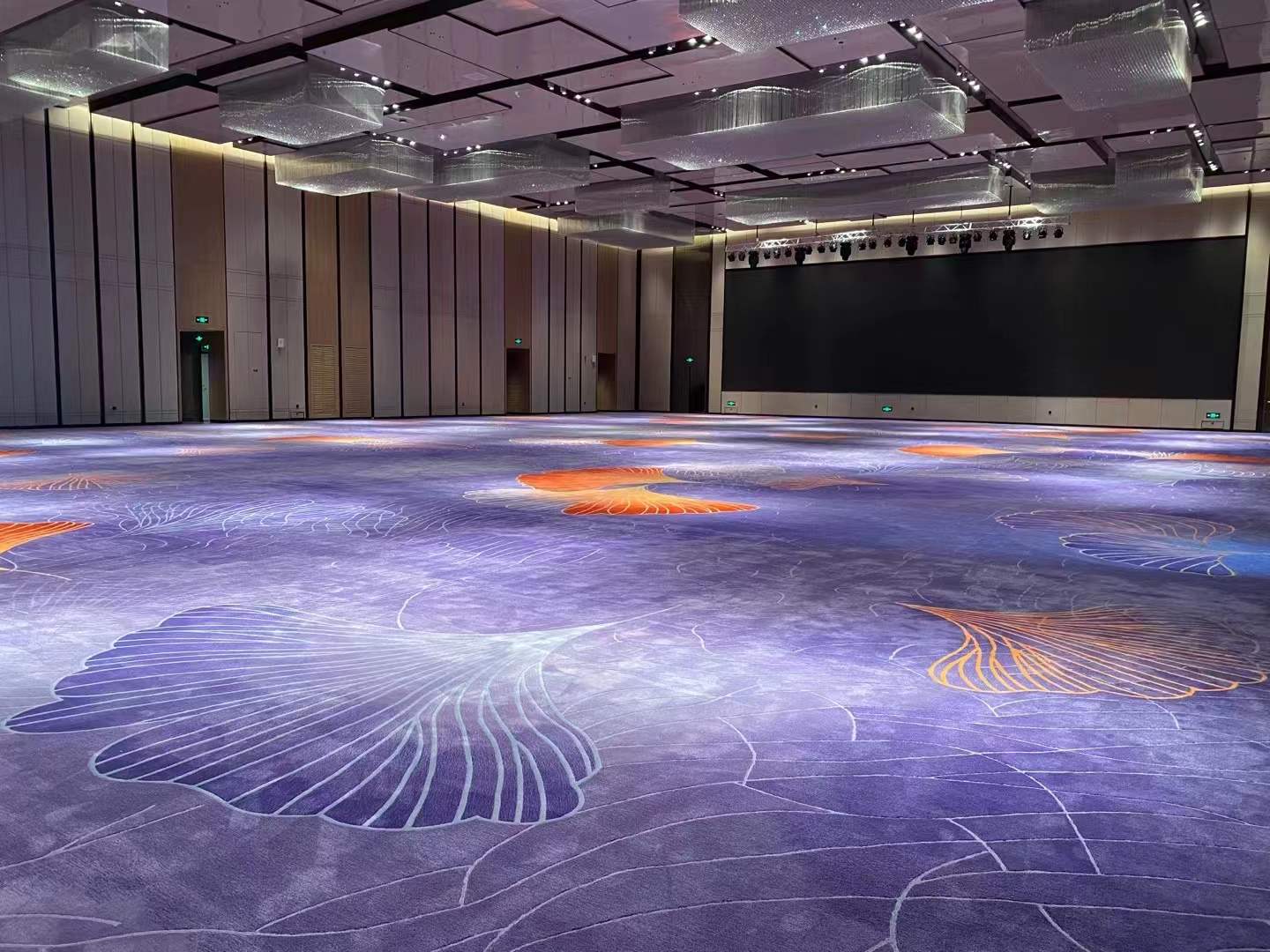 Lavender, blue and gold custom carpet across an open hotel ballroom