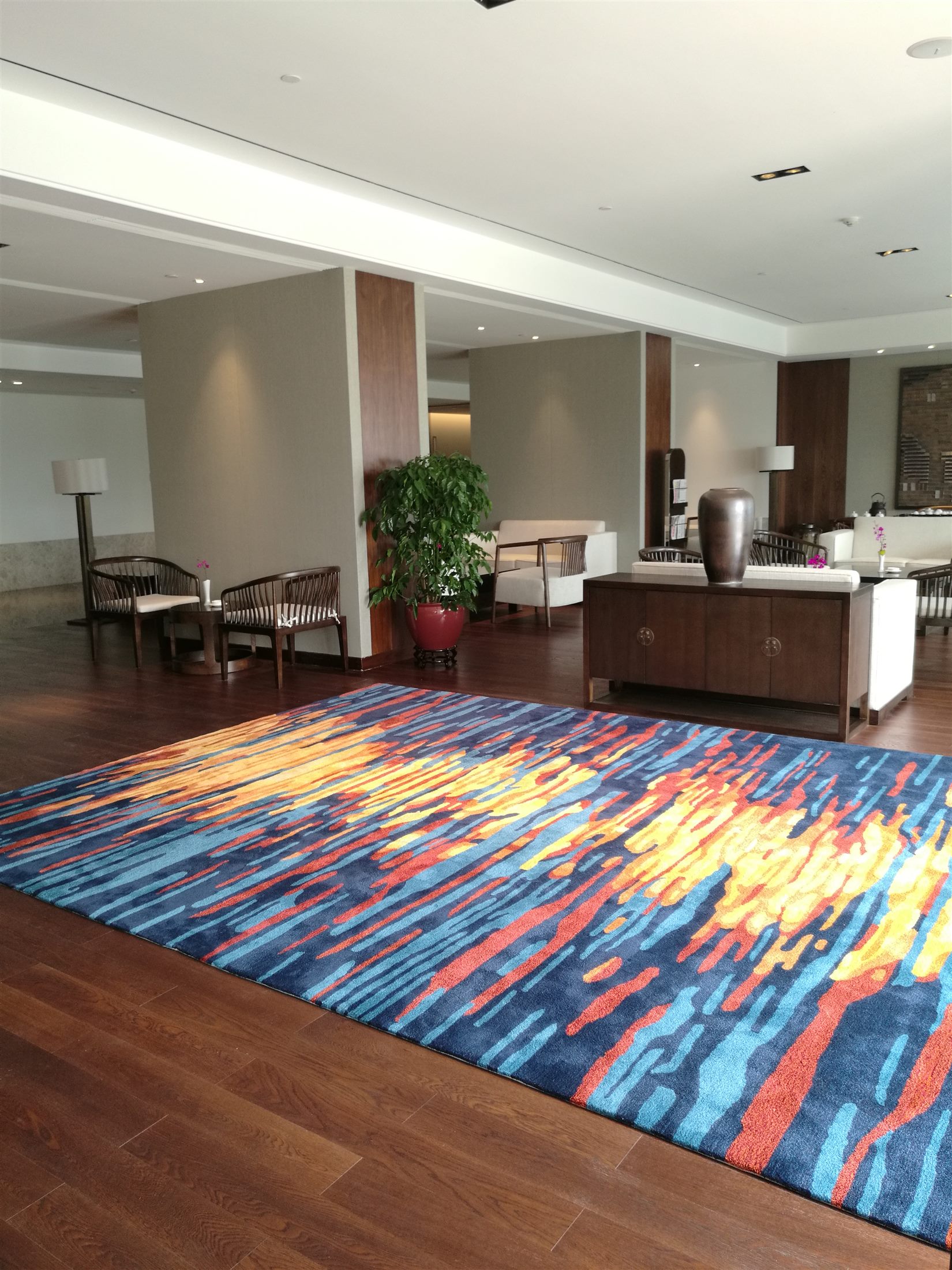 Bright blue, orange and gold carpet in a public lounge
