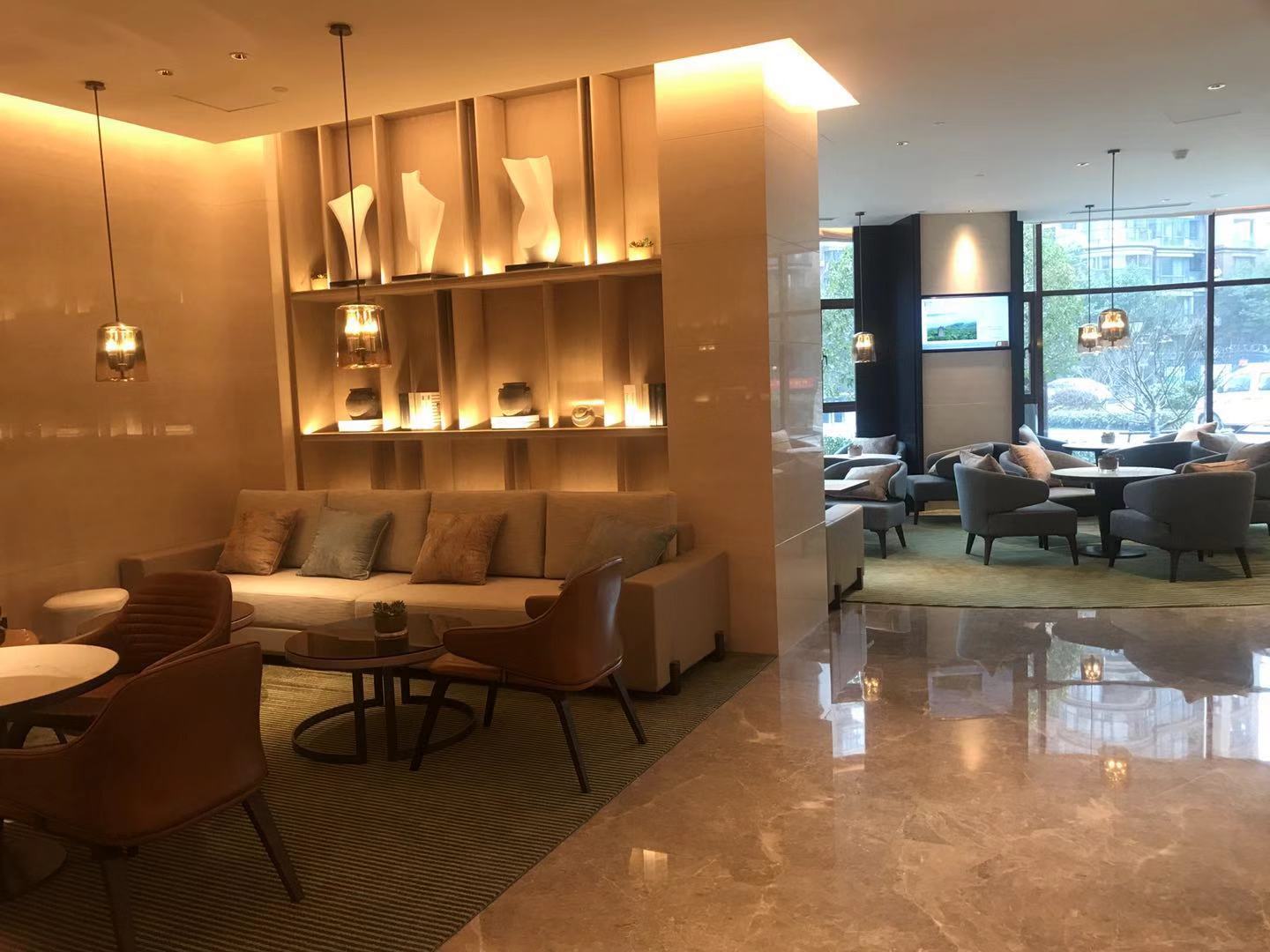 Hotel lounge with a green linear carpet