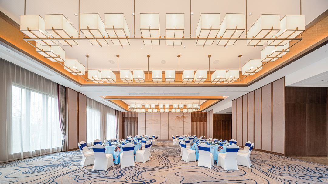 Pale blue contour carpet across a hotel banquet room
